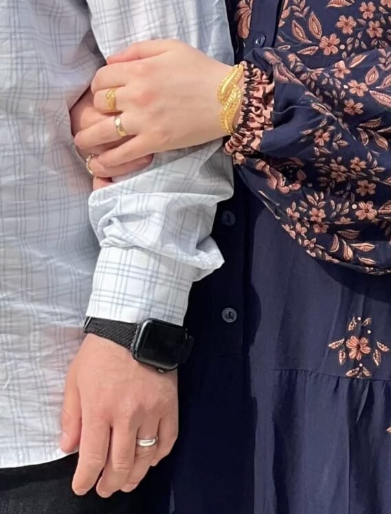 Male and female holding hands pre marriage assessment form